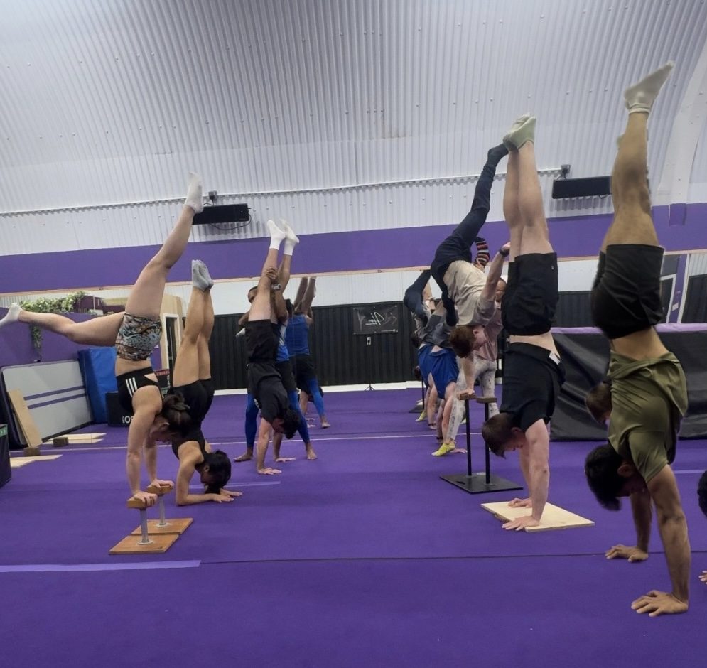 The whole class up in handstands at OverGravity, Shadwell